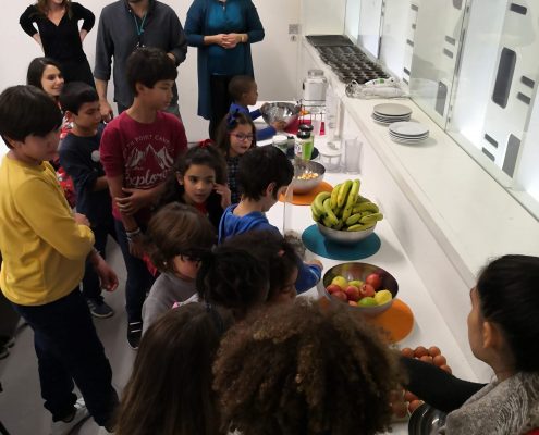 Children learn about health and nutrition while making a snack.